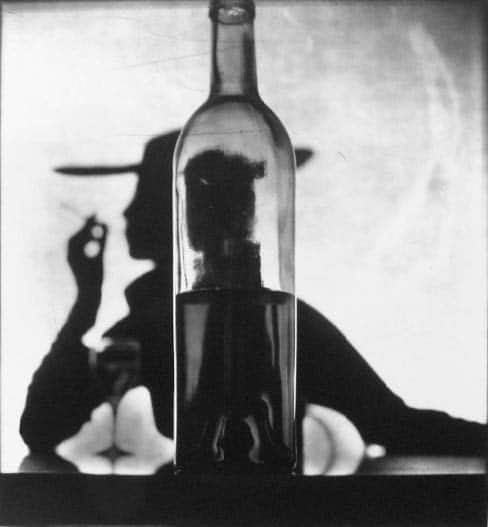 Irving Penn, Girl Behind Bottle (Jean Patchett), 1949 © The Irving Penn Foundation, courtesy of Pace Gallery