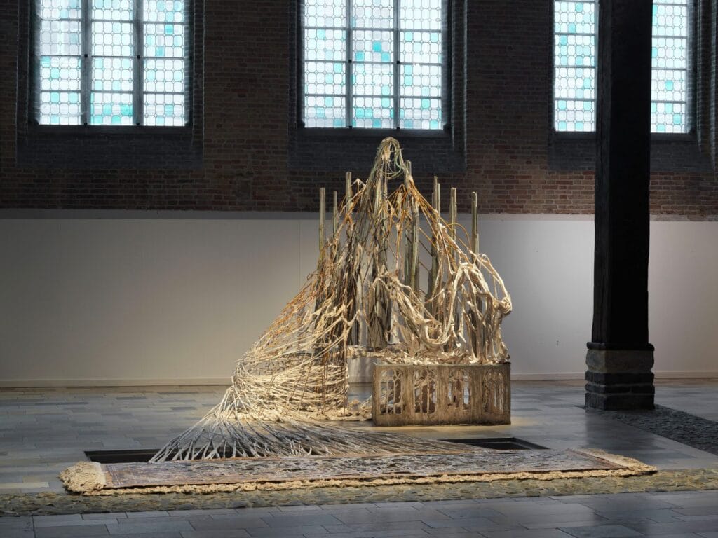 Diana Al-Hadid, Allegory by a Thread, 2020, polymer gypsum, fiberglass, bronze, steel, plaster, pigment, 134 x 155 x 300 inches, 340.36 x 393.7 x 762 cm. Installation at Musea Brugge, Belgium. Photo by Dominique Provost.