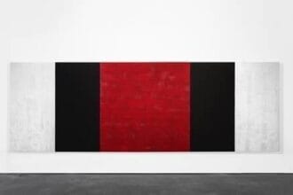 Mary Corse, Untitled (White, Black, Red, Beveled), 2019 Glass microspheres in acrylic on canvas, 78 x 216 inches © Mary Corse, courtesy Kayne Griffin Corcoran