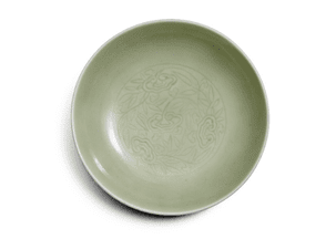 A Celadon-Glazed Dish, Qing Dynasty, Yongzheng Mark and Period. Estimate $40,000-60,000