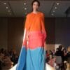 First Fashion Gala Rudi Brook modeling a dress designed by Jan Taminiau