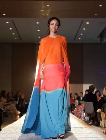 First Fashion Gala Rudi Brook modeling a dress designed by Jan Taminiau