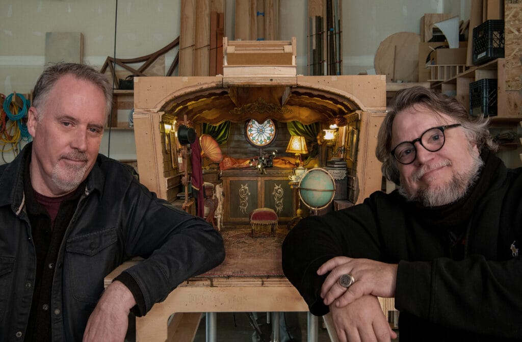 Left to right: Mark Gustafson and Guillermo del Toro on the set of Guillermo del Toro’s Pinocchio, 2022. Image courtesy Jason Schmidt/Netflix