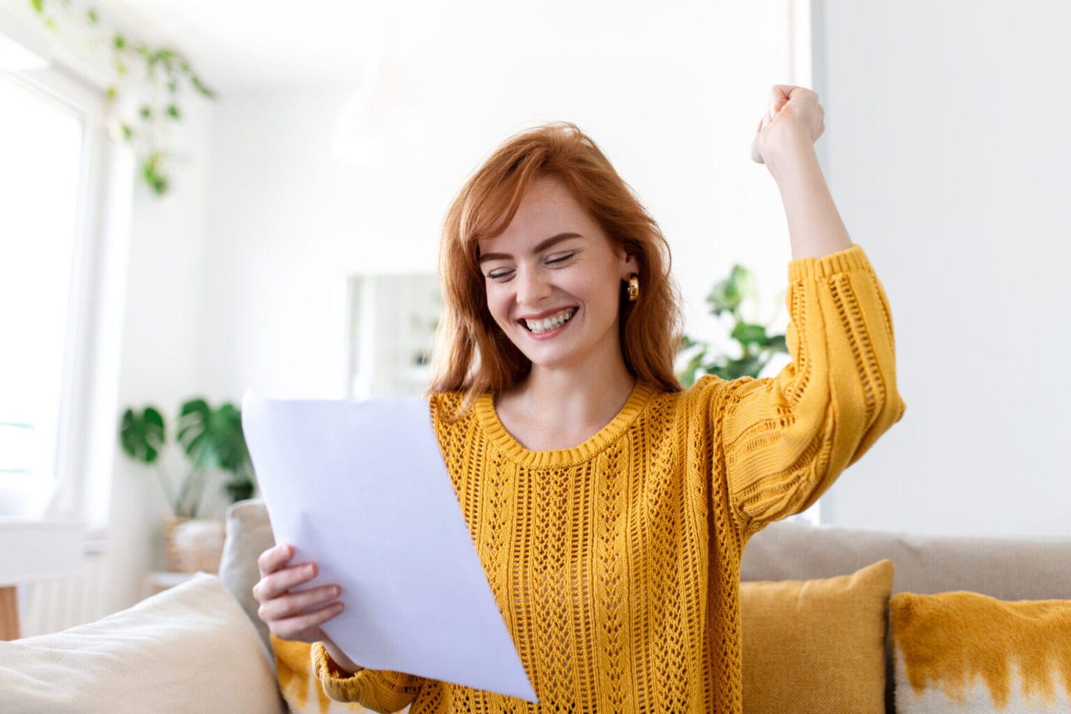 excited young woman hold paper letter feel euphoric receiving job promotion tax refund from bank happy woman reading paperwork document smiling good pleasant news getting student scholarship
