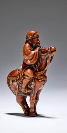 A wood Netsuke of a mounted Chinese horseman by Hoshin, Kyoto, late 18th century sold for €127,400