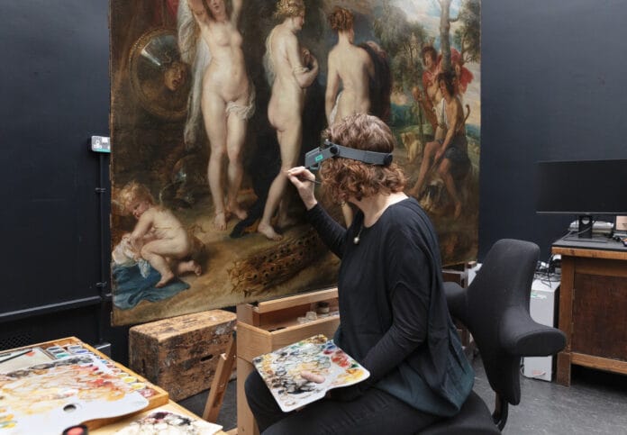 Conservator Britta New retouching The Judgement of Paris during the conservation treatment © The National Gallery, London