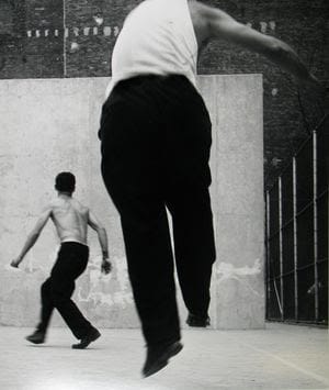 Leon Levinstein, Handball Players, Houston Street, New York, 1955. Gelatin silver print; printed later. Image size: 18 1/8 x 15 5/8 inches; Paper size: 20 x 16 inches. © Estate of Leon Levinstein, Courtesy of Howard Greenberg Gallery, New York